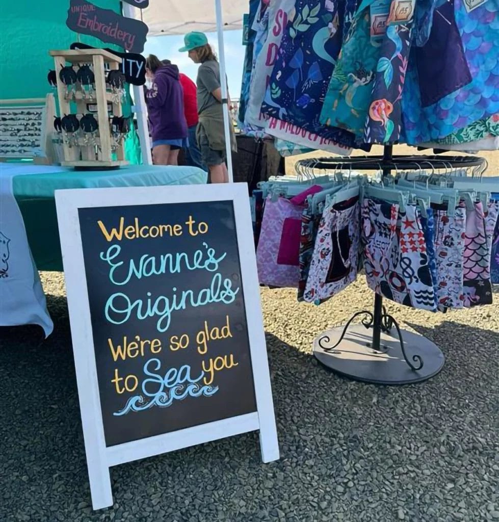 A look at the signage and display for “Evanne’s Originals” booth setup at the market.