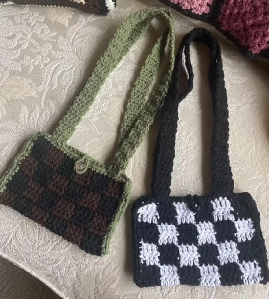 Crocheted bags handmade by Laura displayed for a photo.