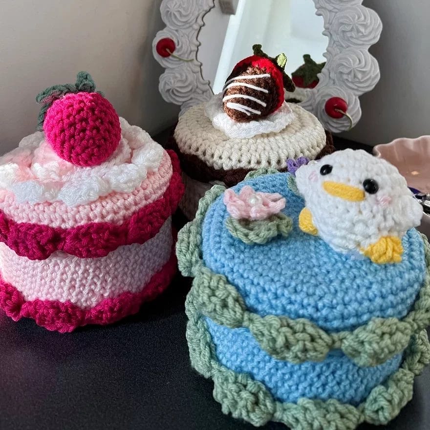Crocheted storage boxes posed for a product photo.