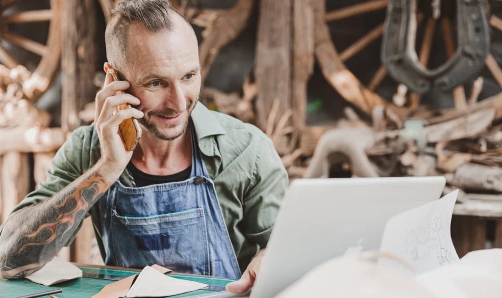 Leather maker artist sells handcraft products online with their own small business studio.