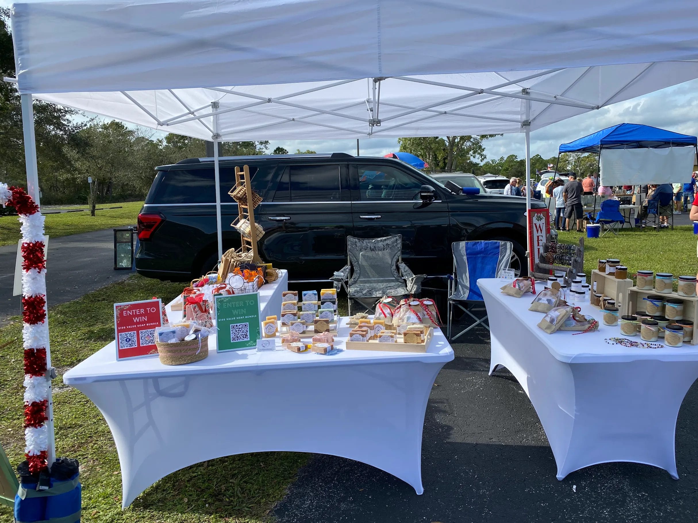 Booth setup by a local vendor at an outdoor market.