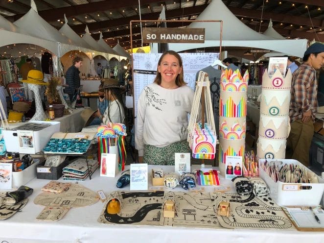 Sarah Omura from SO Handmade selling kids’ travel playmats at an indoor market at Field+ Supply in Kingston, NY