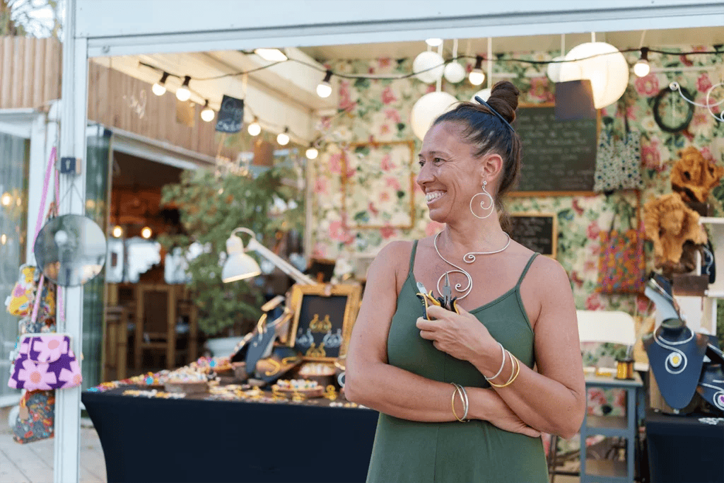 Jewelry vendor at an outdoor market event.