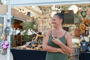 Jewelry vendor at an outdoor market event.